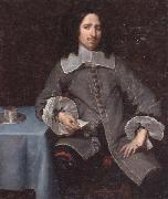 Portrait of a gentleman,three-quarter length,standing beside a table unknow artist